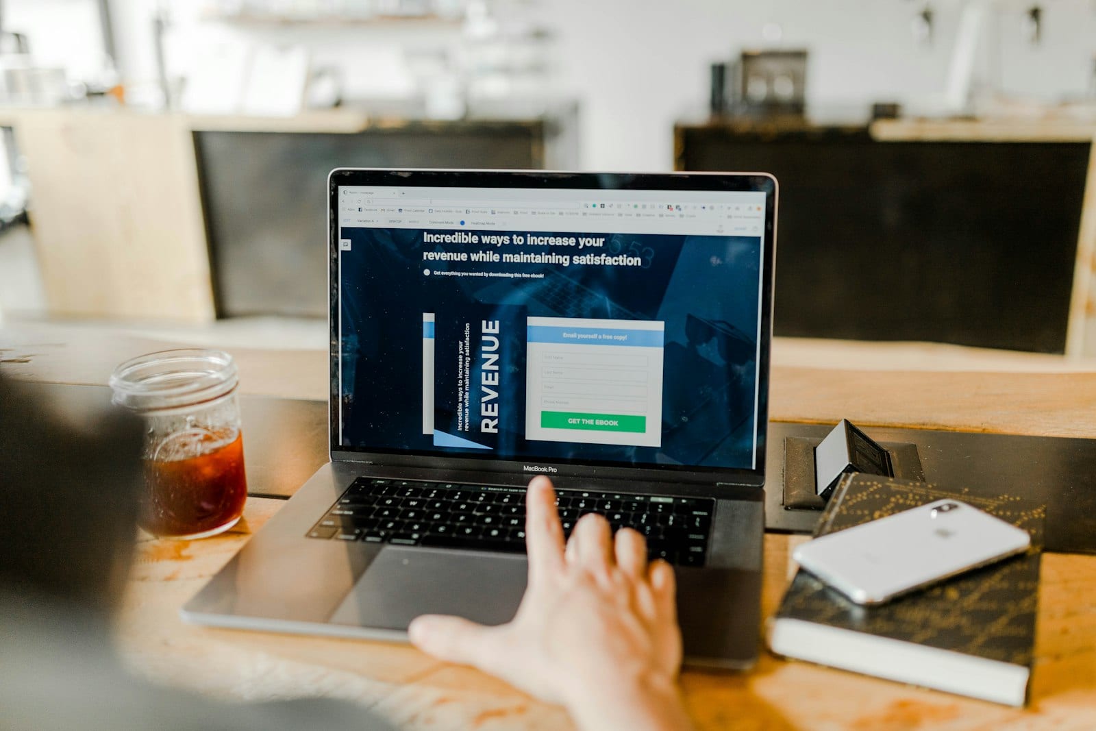 Laptop showing a spreadsheet next to a smartphone budgeting app
