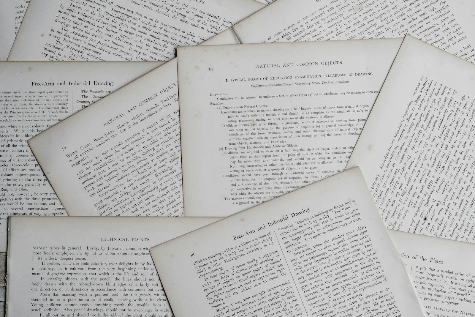 Dictionary and financial documents on a desk with a pen